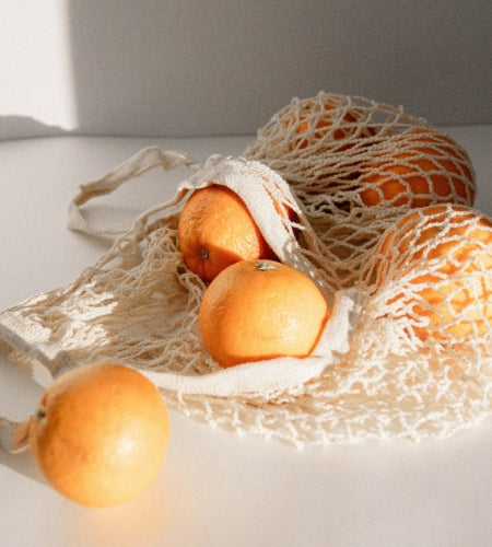 Oranges in a reusable bag