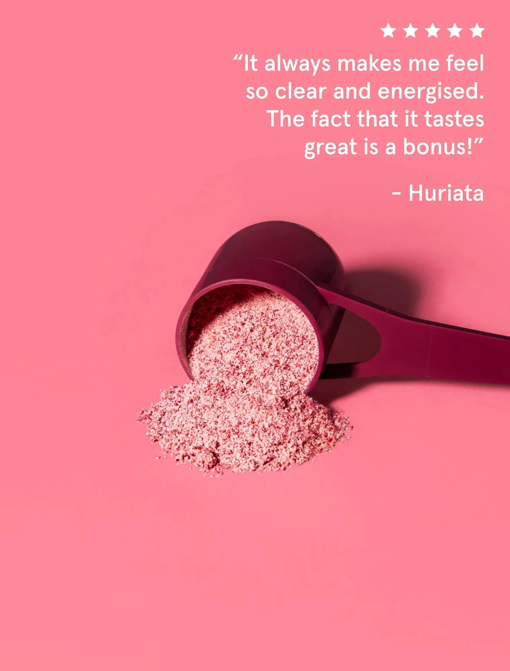 A scoop of the Beauty Brain supplement on a pink background. The image has a customer review overlaid on it that reads: It always makes me feel so clear and energised. The fact that it tastes great is a bonus!.