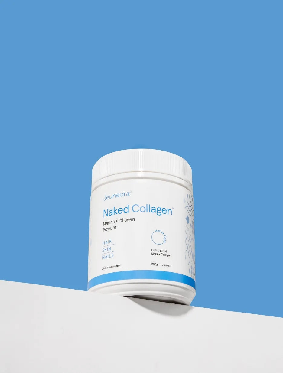 A container of Naked Collagen sits on a white shelf with a blue background