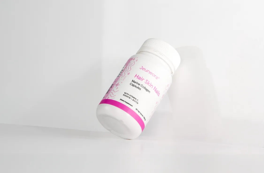 A Hair Skin Nails container of capsules on a white background