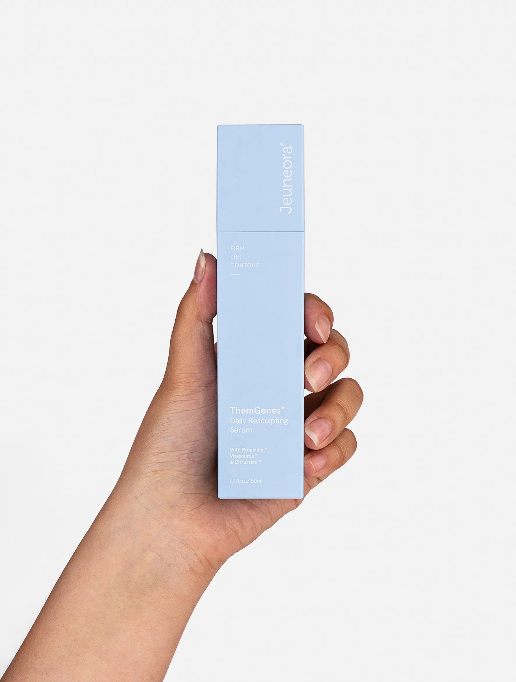 hand holding themgenes daily serum